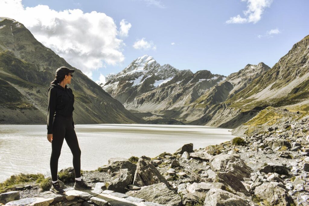 Girl hiking Mount Cook Hooker Valley Track in New Zealand