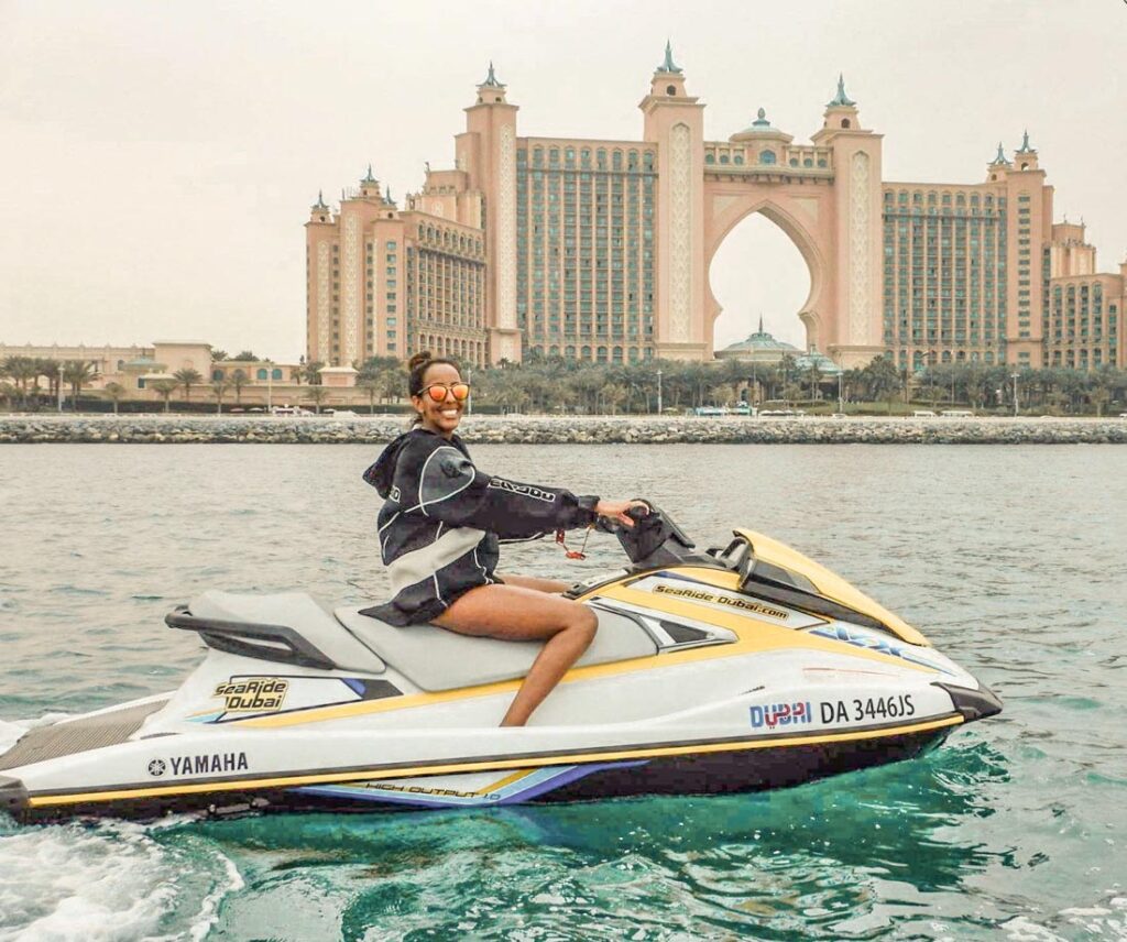 Girl jet skiing in front of Dubai Atlantis Hotel