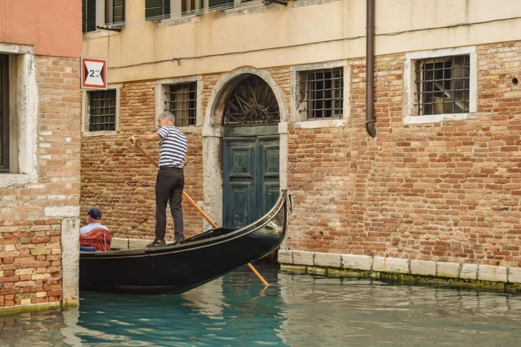 Gondola on a canal in Venice, Italy