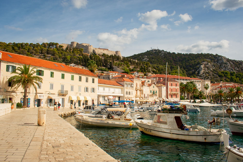 Hvar Town port with castle in background