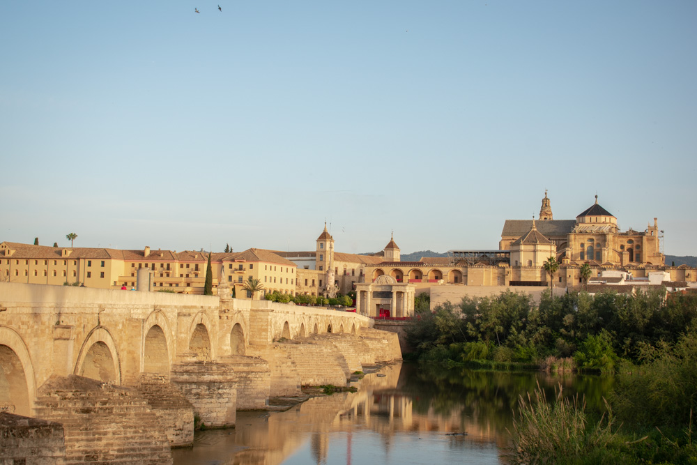 Roman bridge leading into Cordoba old town with Mezquita-Cathedral in the background