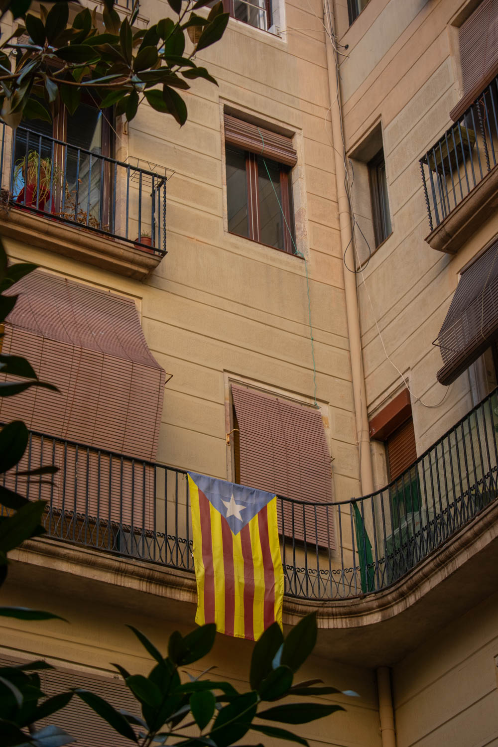 Catalonia flag hanging from a balcony in Barcelona's Gothic Quarter
